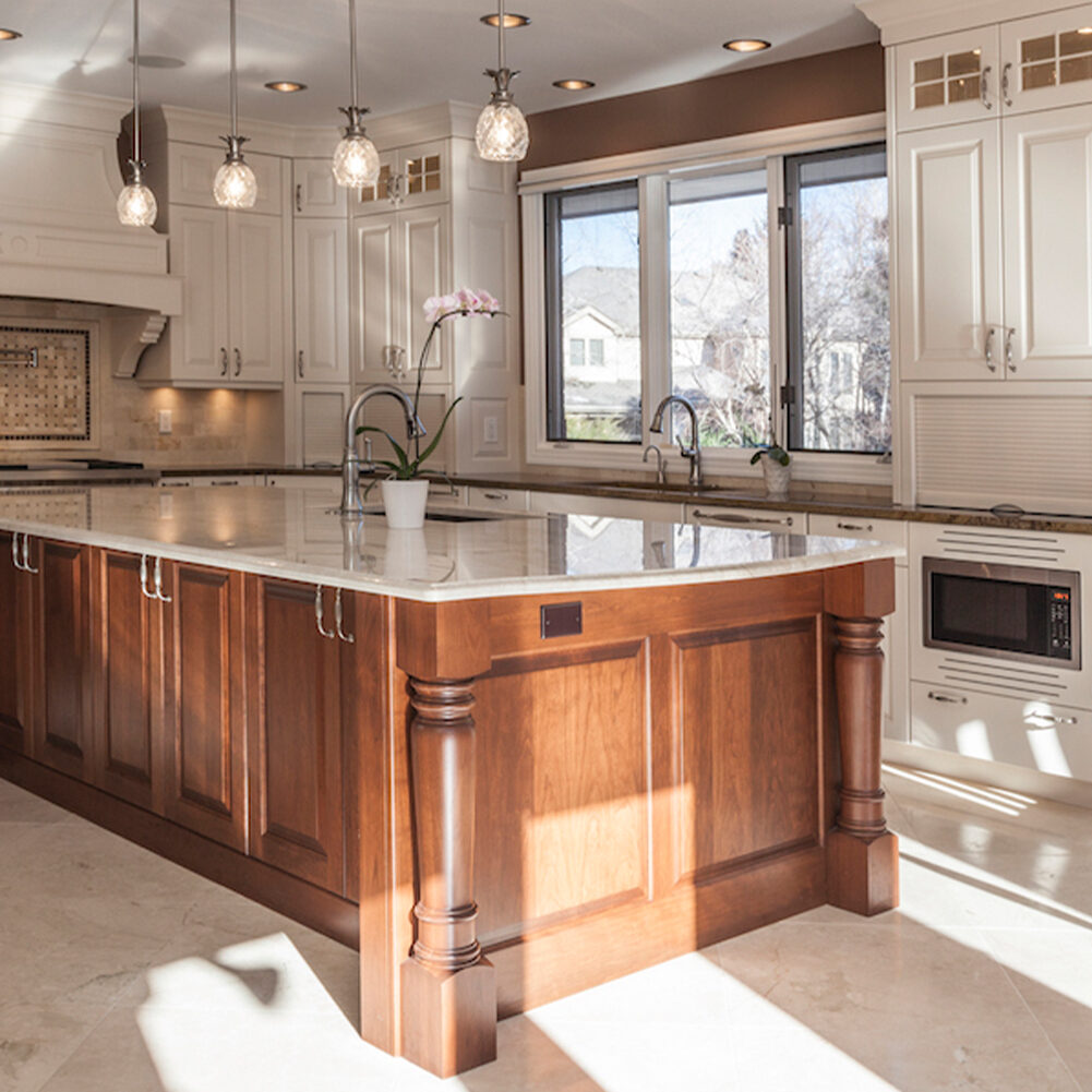 image of a clean white kitchen and wood grain island